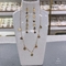 ست گردنبند و گوشواره بلند نماد جادویی طلای 14 عیار بر روی جواهرات استیل