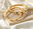 دستبند دوستی 18 کیلویی طلایی با سنگ‌های زیرکونیایی مکعبی